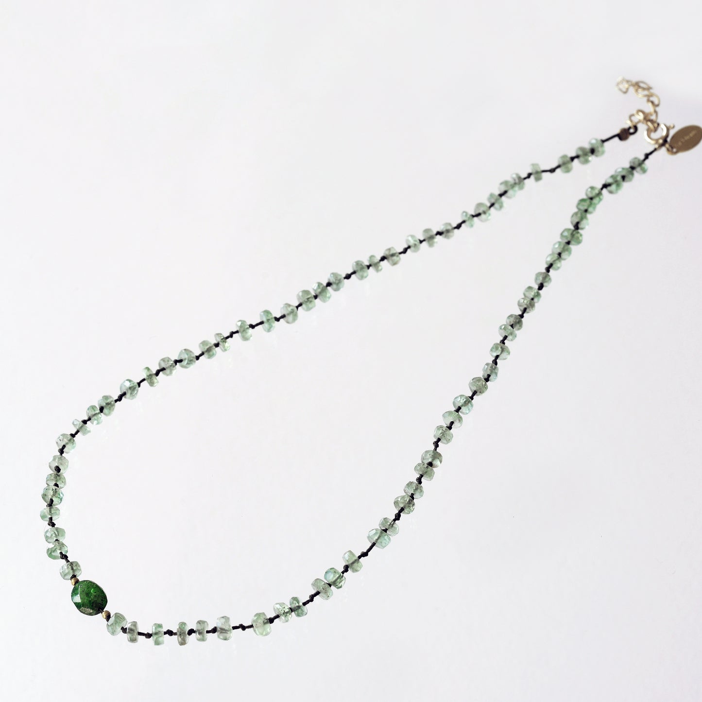 Full mint kyanite necklace and 1 oval travorite