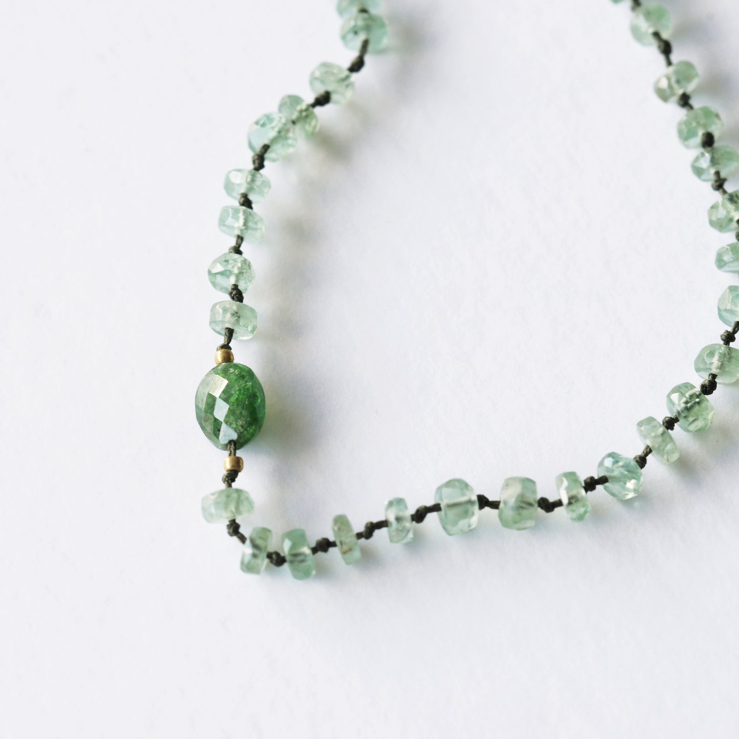 Full mint kyanite necklace and 1 oval travorite