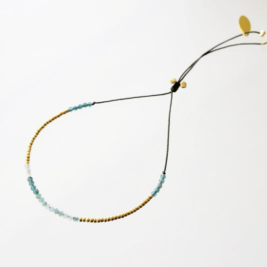 Bracelet on khaki fill with grandidierite and mini pearls