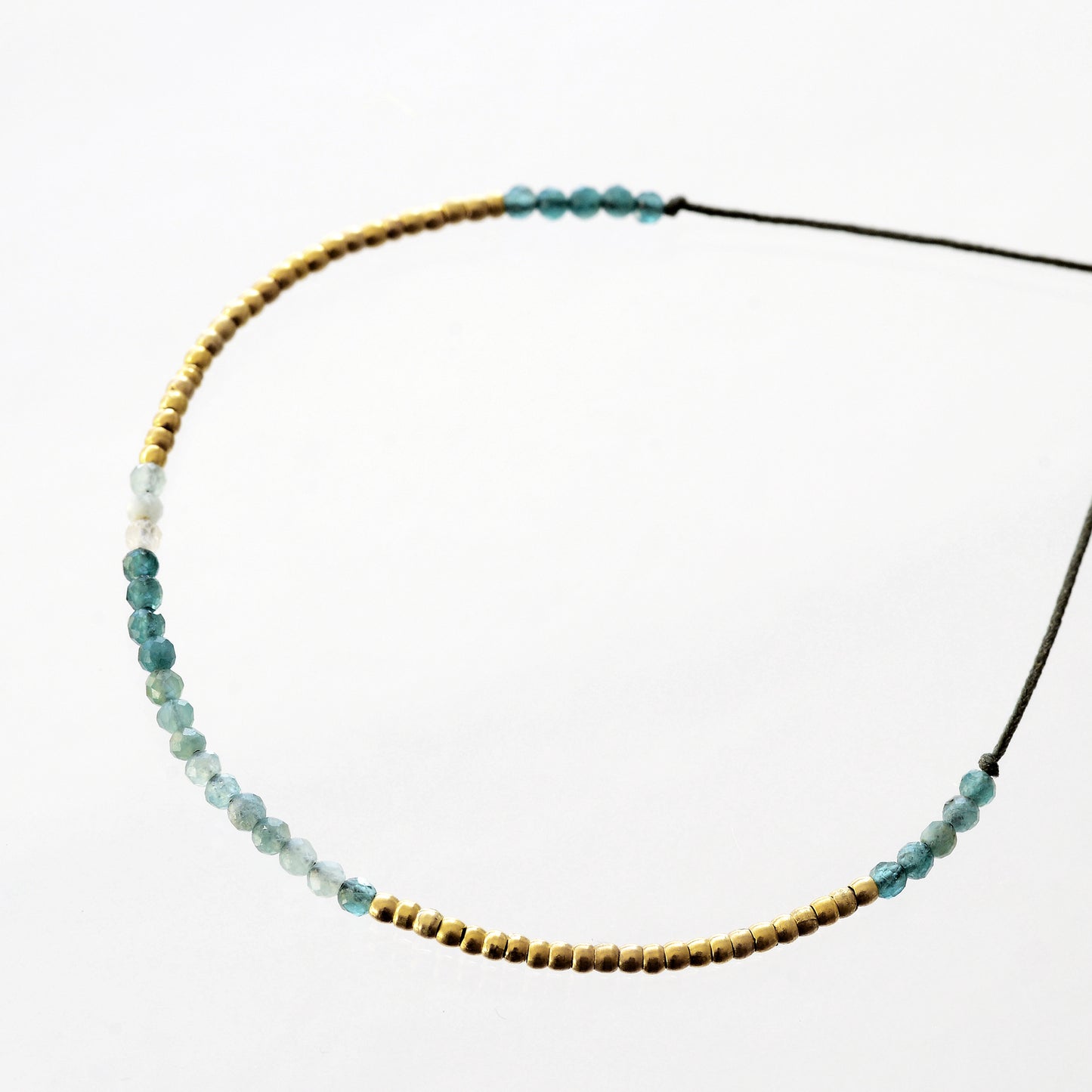 Bracelet on khaki fill with grandidierite and mini pearls