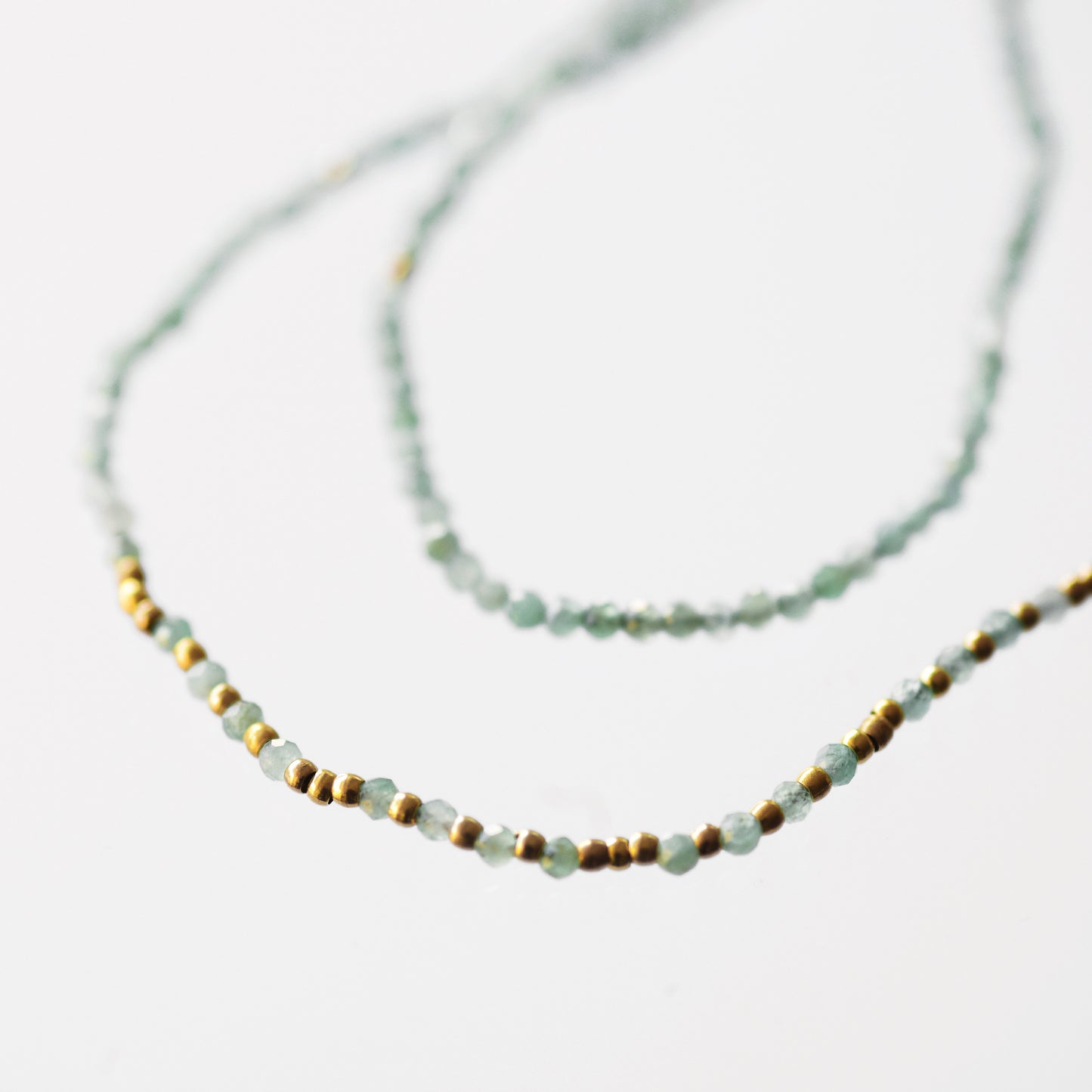 Emerald necklace and mini golden pearls